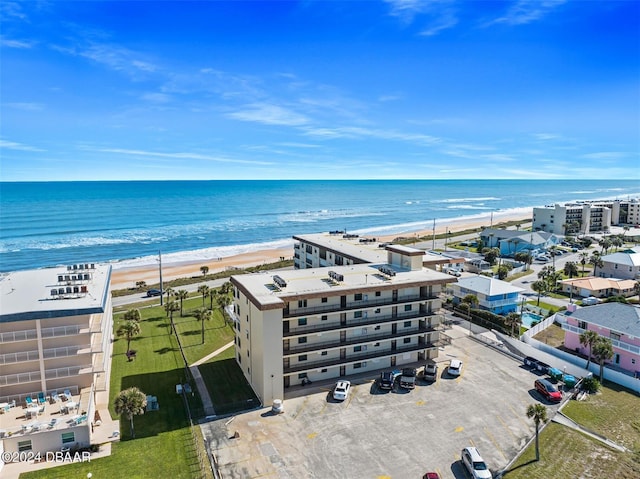 bird's eye view with a view of the beach and a water view