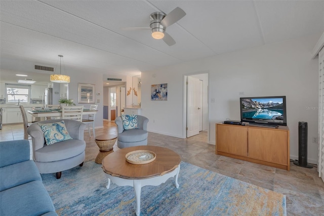 living room featuring ceiling fan