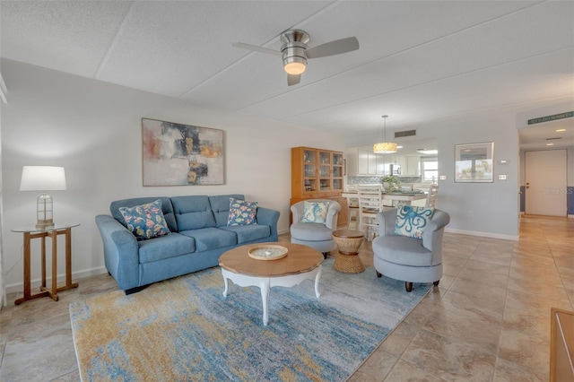 living room featuring ceiling fan