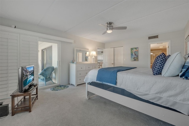 bedroom featuring ceiling fan, light carpet, and a closet