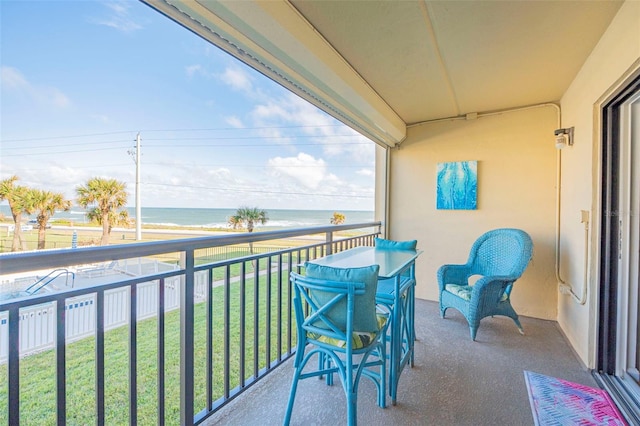 balcony featuring a water view