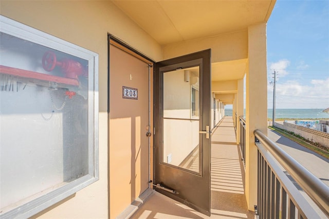 balcony featuring a water view