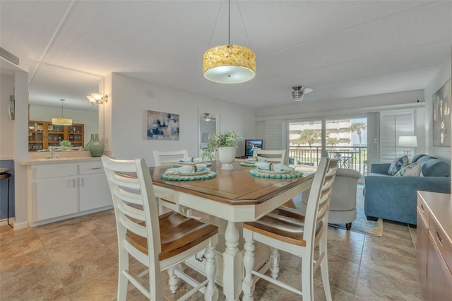 dining room featuring sink