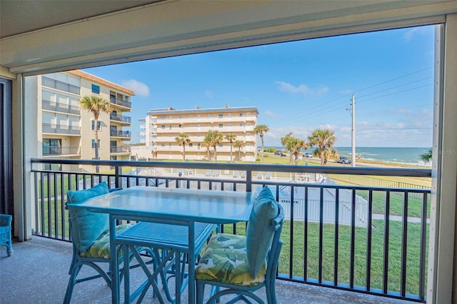 balcony featuring a water view