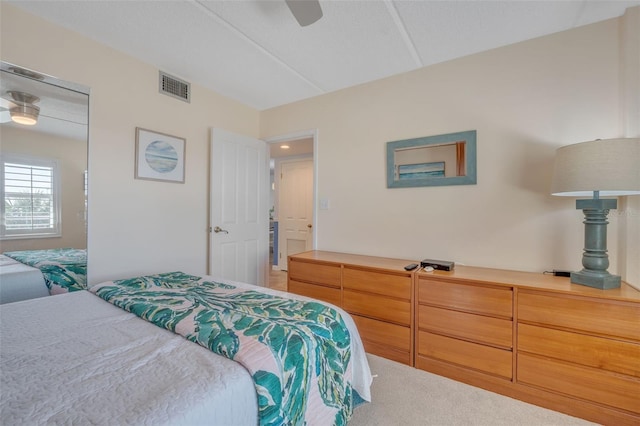 bedroom with ceiling fan and carpet floors