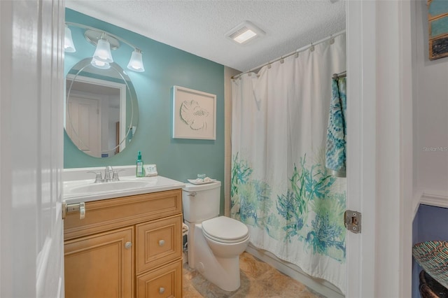 full bathroom with shower / bath combo with shower curtain, vanity, a textured ceiling, and toilet