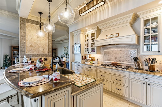 kitchen featuring custom exhaust hood, dark stone counters, crown molding, sink, and appliances with stainless steel finishes