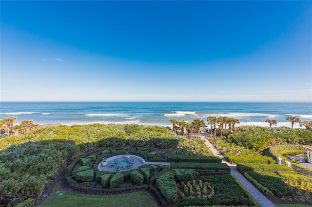 exterior space with a water view and a view of the beach