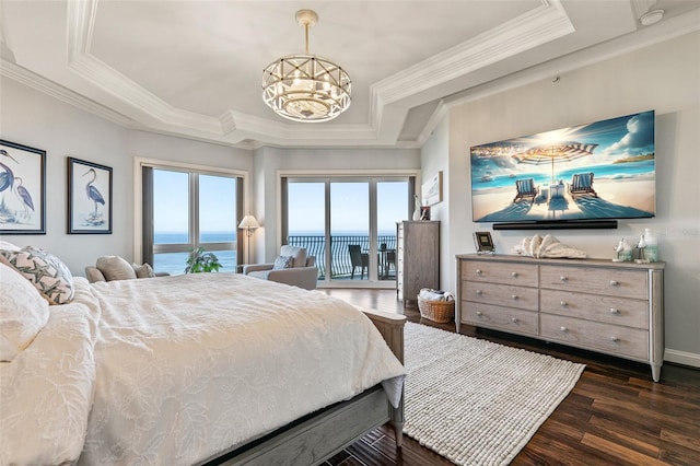 bedroom with ornamental molding, access to outside, a raised ceiling, dark wood-type flooring, and an inviting chandelier