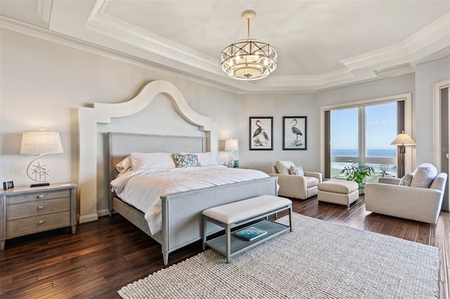 bedroom with dark hardwood / wood-style floors, a water view, ornamental molding, and a notable chandelier