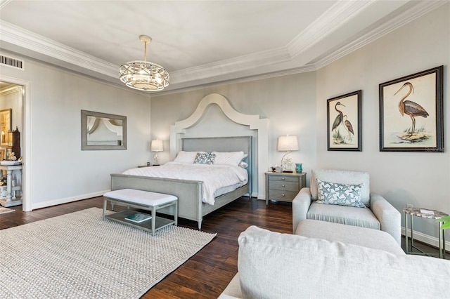 bedroom with dark hardwood / wood-style floors, an inviting chandelier, and crown molding