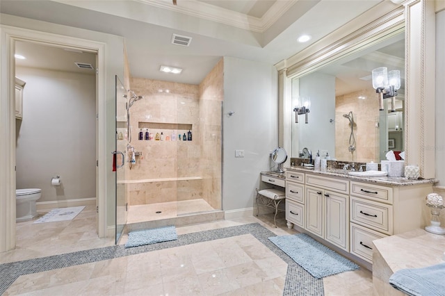 bathroom featuring crown molding, a shower with door, vanity, and toilet