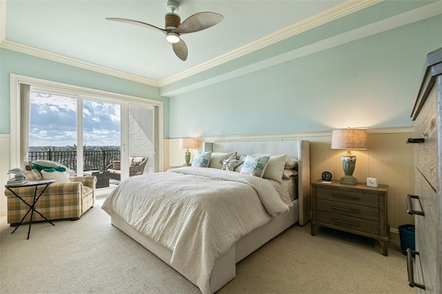 carpeted bedroom featuring ceiling fan, crown molding, and access to outside