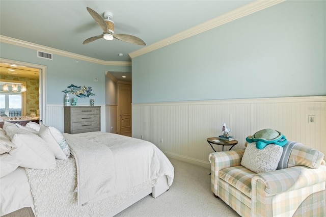 bedroom featuring light carpet, ceiling fan, and ornamental molding