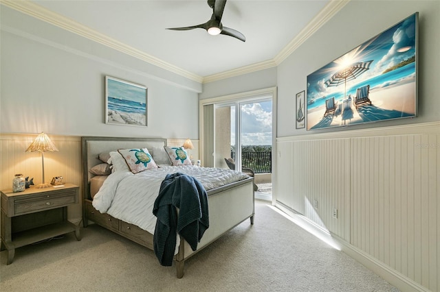 carpeted bedroom with access to exterior, ceiling fan, and crown molding