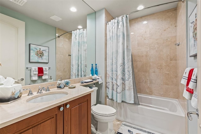 full bathroom featuring shower / tub combo, vanity, and toilet