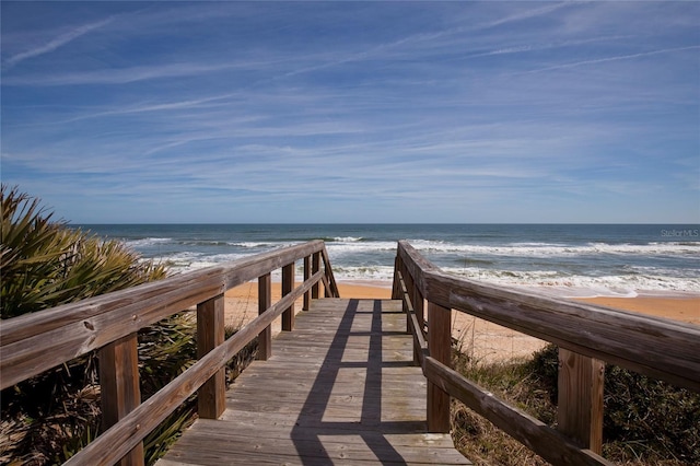 view of community featuring a water view and a view of the beach