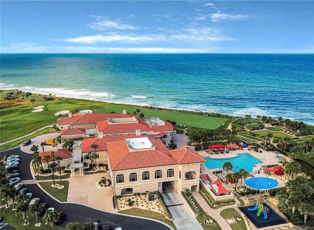 bird's eye view featuring a water view and a beach view