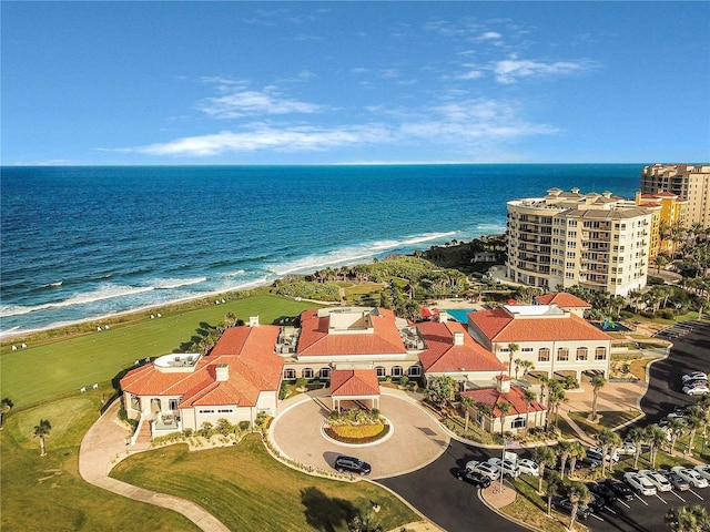 aerial view with a water view and a view of the beach