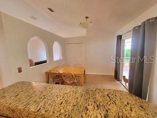 kitchen with light stone countertops