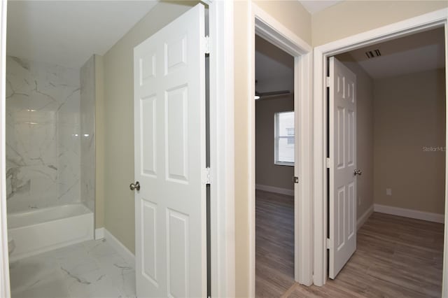 corridor featuring light hardwood / wood-style flooring