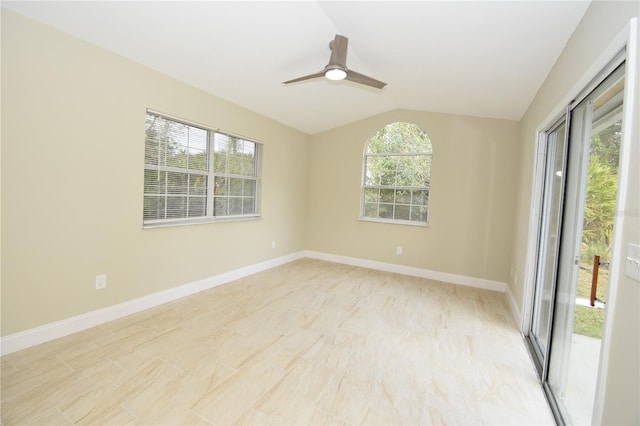 spare room featuring lofted ceiling and ceiling fan