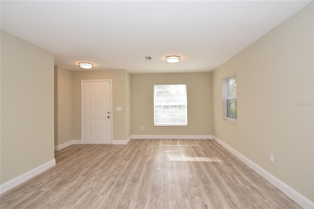 unfurnished room featuring light wood-type flooring