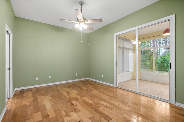 unfurnished room with ceiling fan and light wood-type flooring