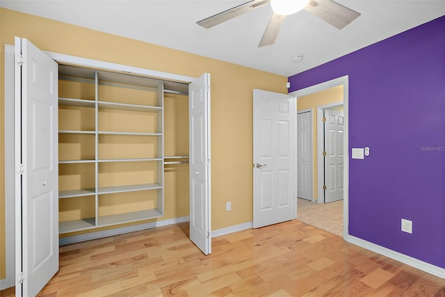 unfurnished bedroom featuring ceiling fan, a closet, and light hardwood / wood-style floors