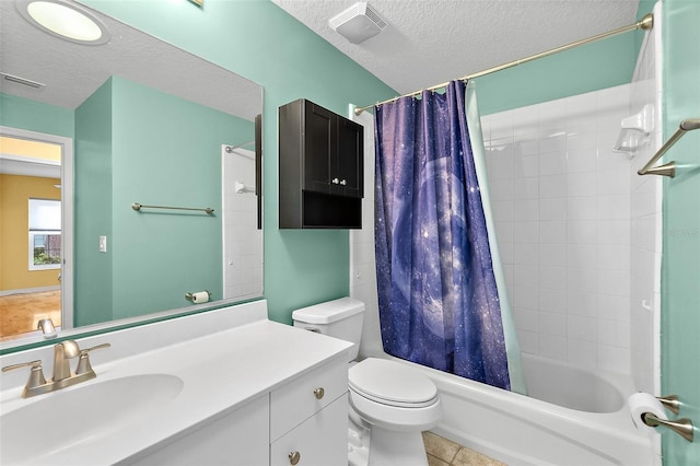 full bathroom featuring vanity, toilet, a textured ceiling, and shower / tub combo