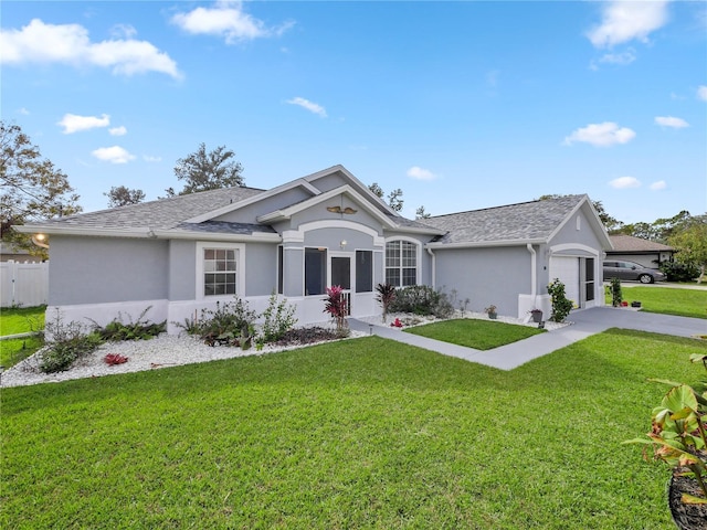 ranch-style home featuring a garage and a front lawn