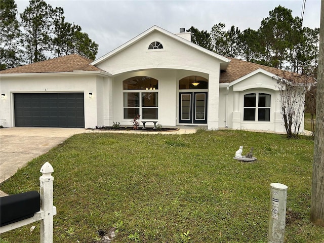 single story home with a garage and a front lawn