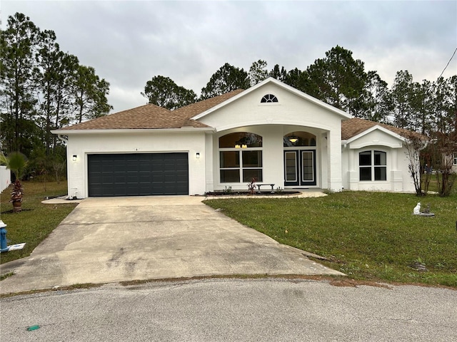 single story home featuring a garage and a front lawn