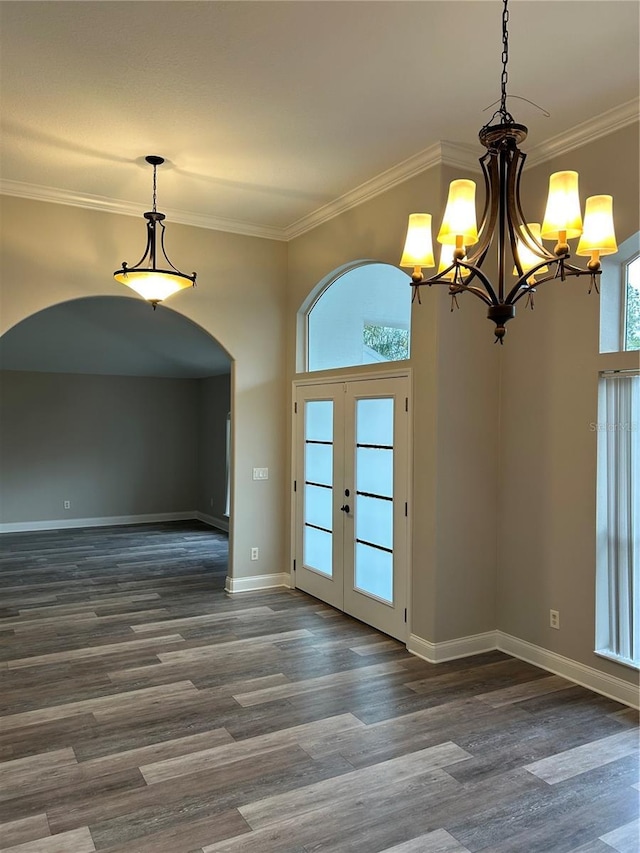 interior space featuring french doors, dark hardwood / wood-style flooring, and crown molding