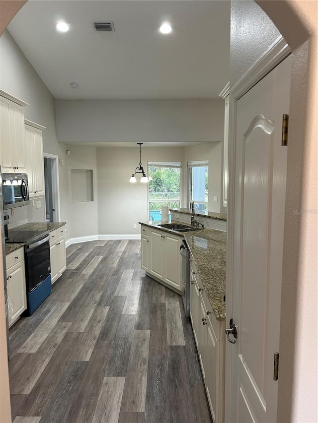 kitchen featuring white cabinets, sink, and appliances with stainless steel finishes