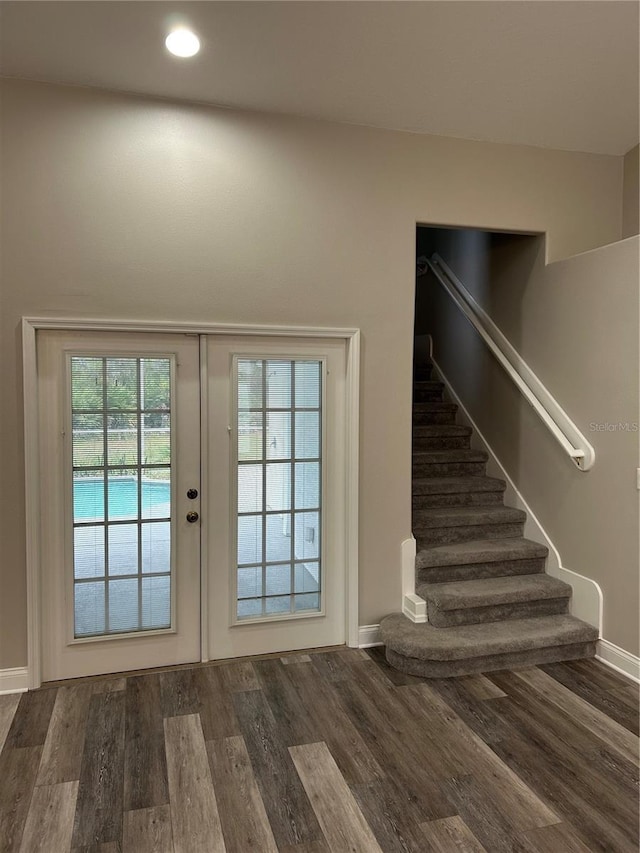 doorway to outside featuring french doors and dark hardwood / wood-style floors