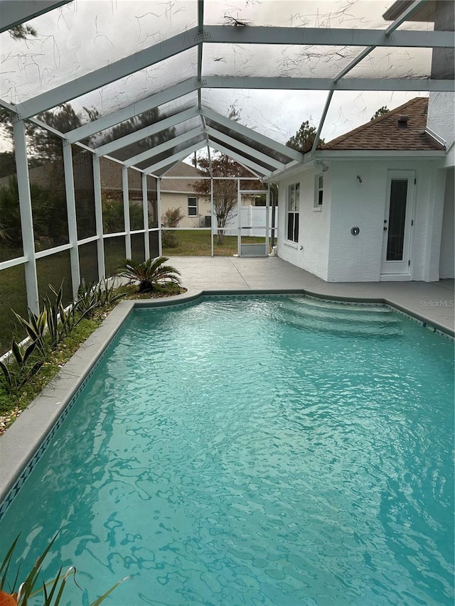 view of pool featuring a lanai and a patio