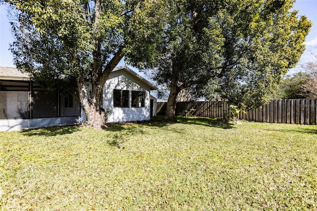 view of yard with a sunroom