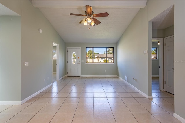 interior space featuring vaulted ceiling, a textured ceiling, and ceiling fan