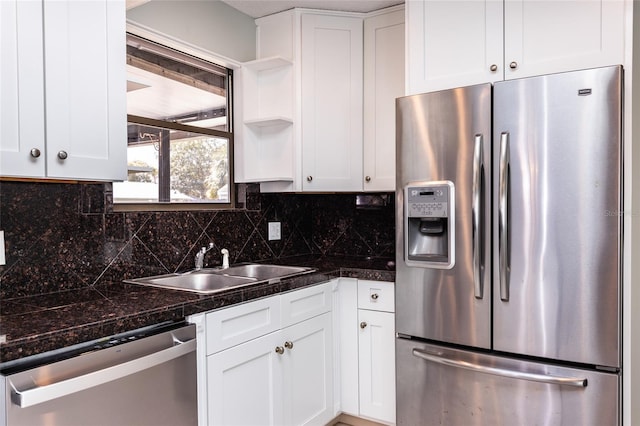 kitchen with white cabinetry, appliances with stainless steel finishes, and sink