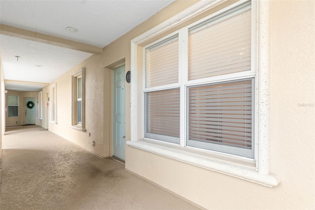 corridor with light carpet