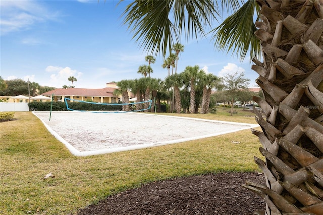 view of property's community featuring a yard and volleyball court