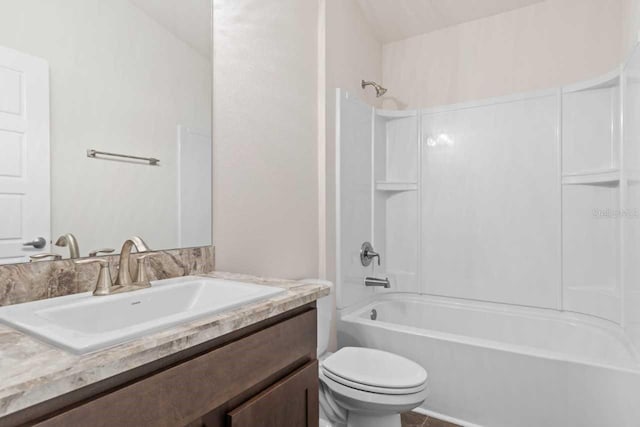 full bathroom with vanity, bathtub / shower combination, and toilet