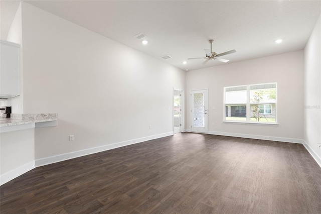 10 Zinc Pl, Palm Coast, FL 32164 - unfurnished living room featuring a ceiling fan, dark wood-type flooring, recessed lighting, and baseboards