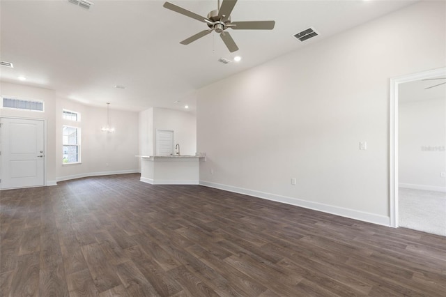10 Zinc Pl, Palm Coast, FL 32164 - unfurnished living room with ceiling fan, dark wood-style floors, a chandelier, recessed lighting, and baseboards