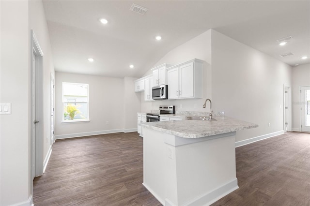 10 Zinc Pl, Palm Coast, FL 32164 - kitchen with appliances with stainless steel finishes, a sink, light countertops, white cabinetry, and dark wood-style flooring
