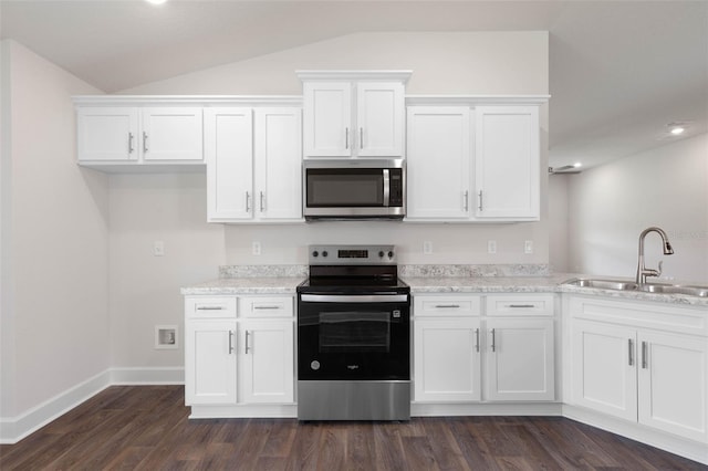 10 Zinc Pl, Palm Coast, FL 32164 - kitchen with appliances with stainless steel finishes, a sink, vaulted ceiling, white cabinets, and recessed lighting