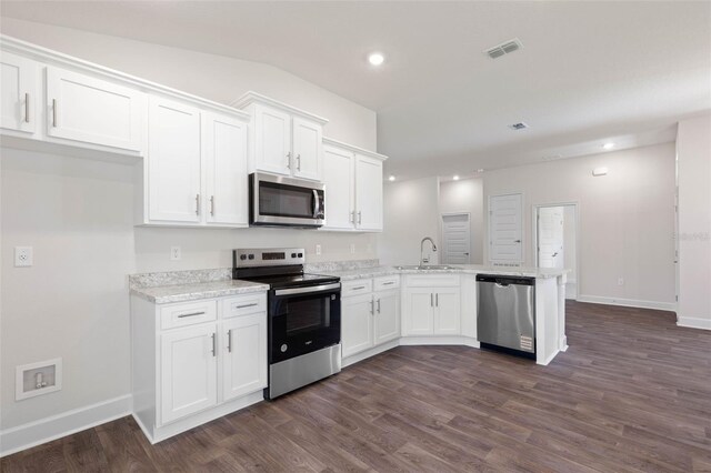 10 Zinc Pl, Palm Coast, FL 32164 - kitchen featuring appliances with stainless steel finishes, a sink, a peninsula, white cabinetry, and baseboards