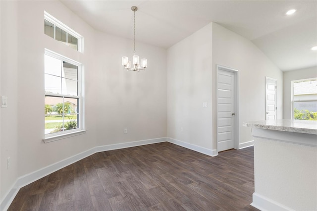 10 Zinc Pl, Palm Coast, FL 32164 - unfurnished dining area with dark wood-type flooring, a chandelier, baseboards, vaulted ceiling, and recessed lighting
