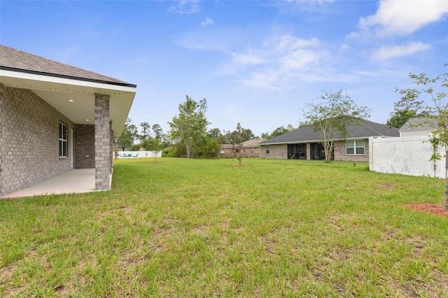 10 Zinc Pl, Palm Coast, FL 32164 - view of grassy yard with a patio